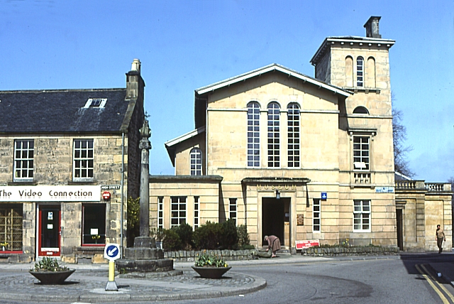 Elgin Museum’s pale classical street front, with tall round-headed windows and a small corner tower