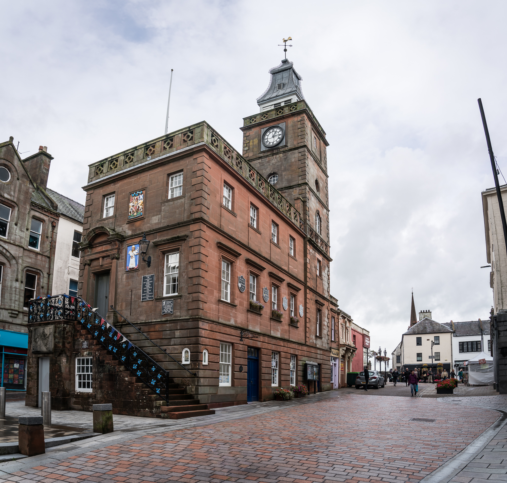 Red sandstone Midsteeple in Dumfries High Street, with its external stair, clock tower and leaded spire
