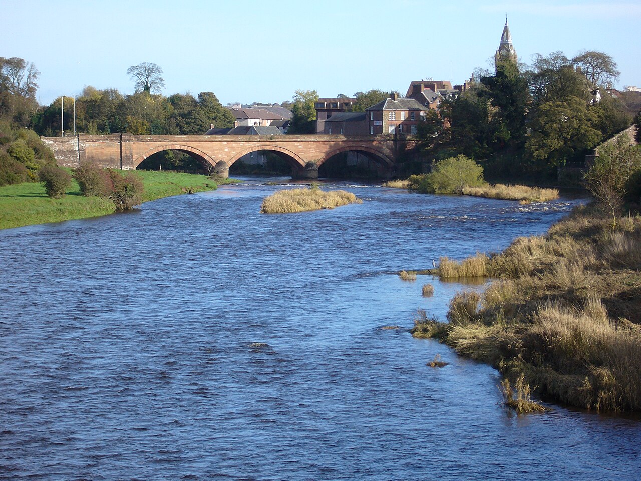 The three stone arches of Annan Bridge crossing the River Annan