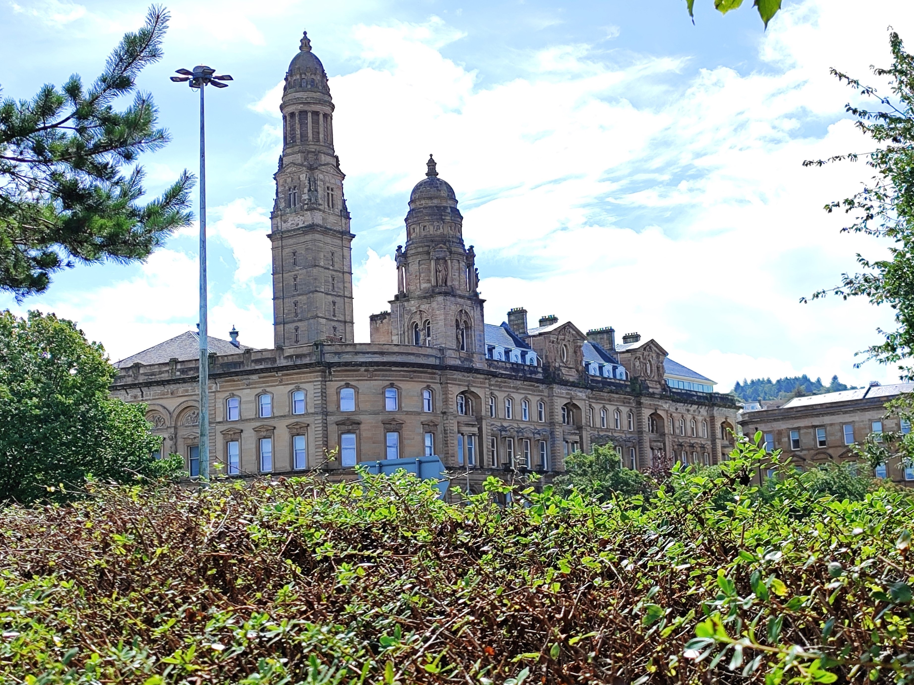 Ornate towers and long classical façade of Greenock Municipal Buildings, seen above Clyde Square