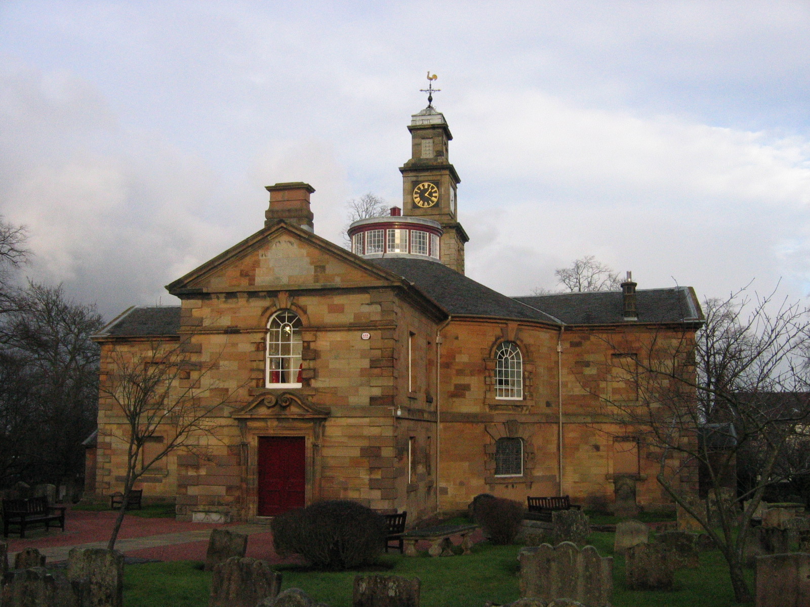 Hamilton Old Parish Church, its circular classical body and roof cupola seen across the churchyard
