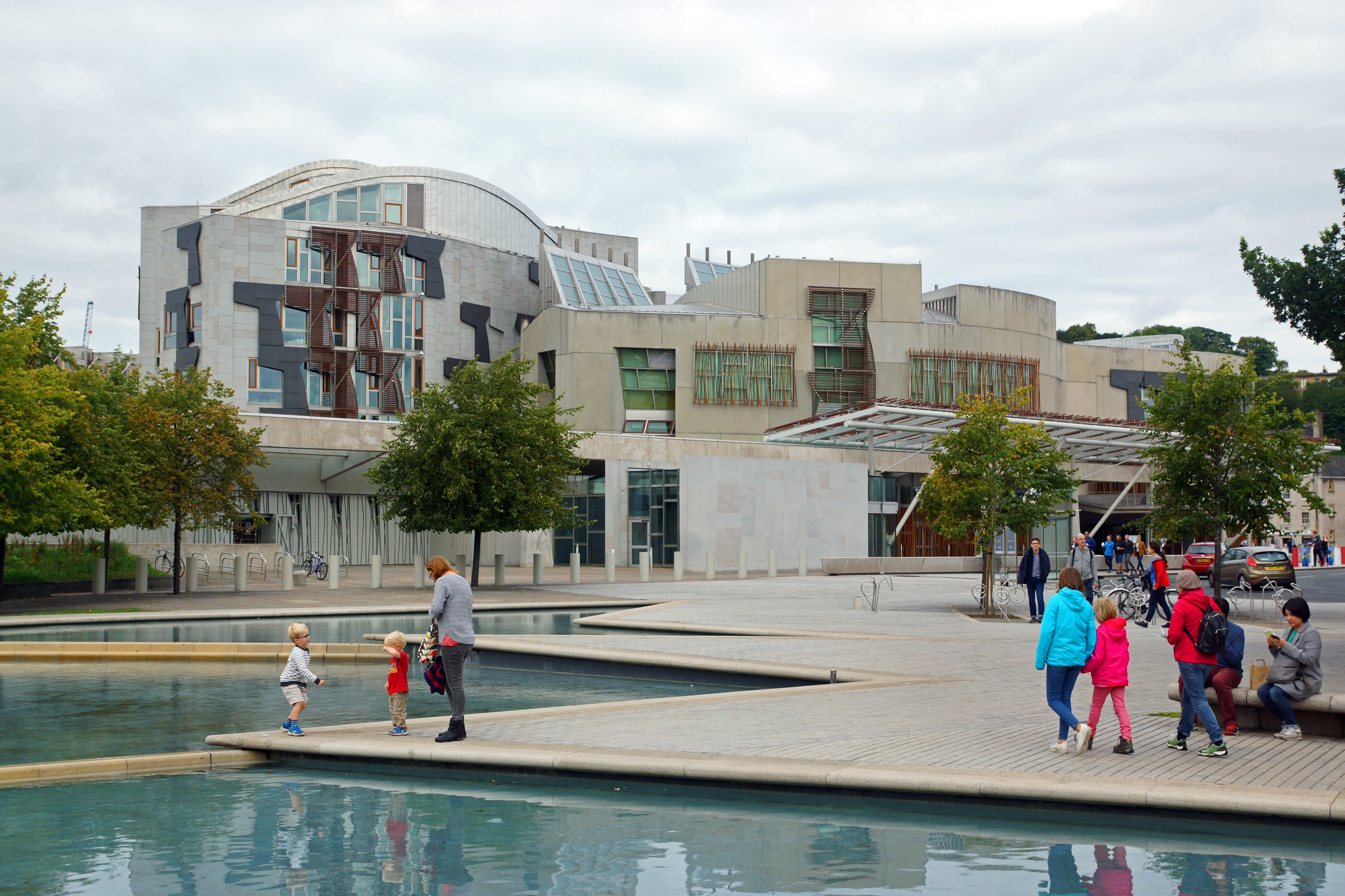 Scottish Parliament Building at Holyrood, viewed across the landscaped pools and public forecourt