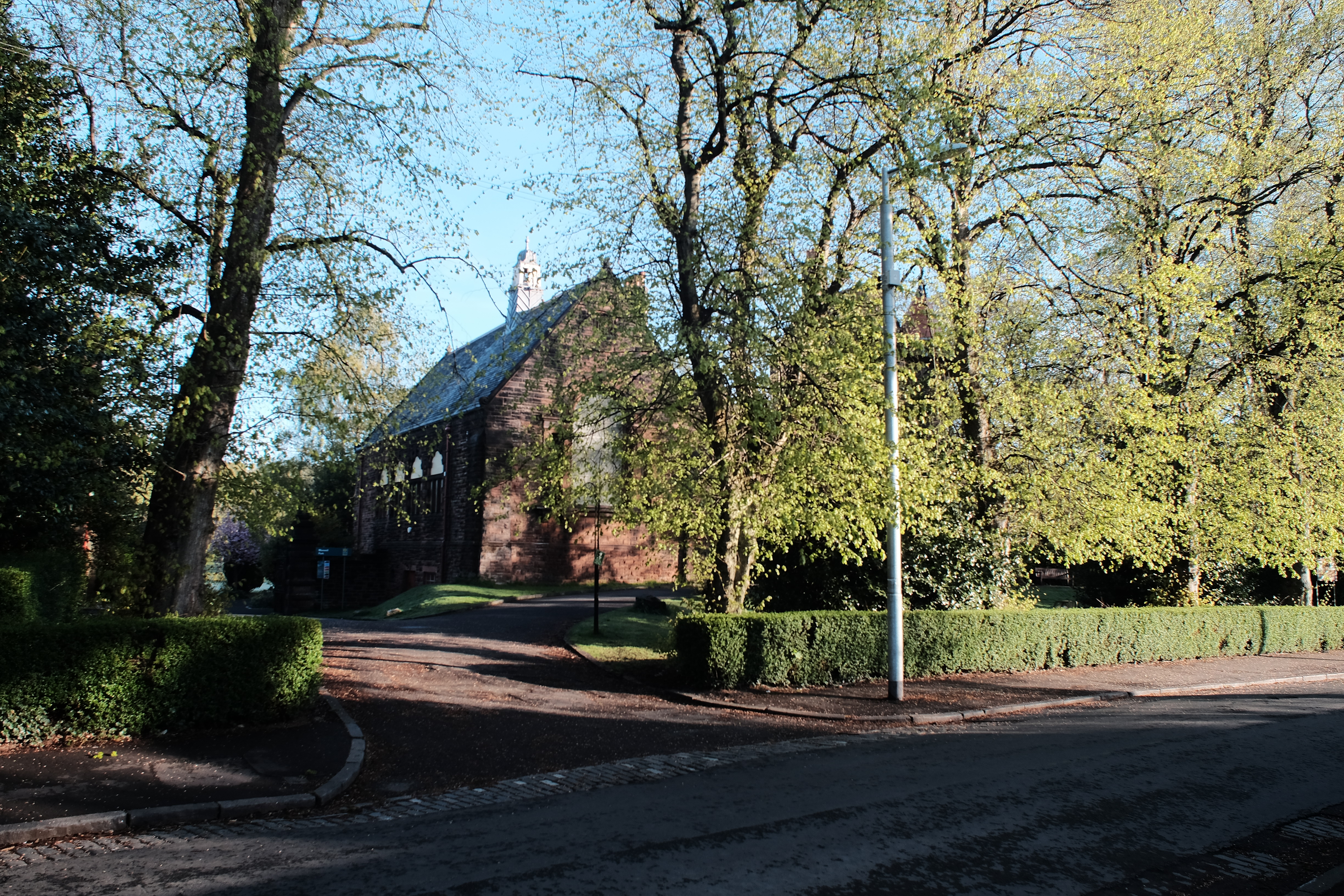 Pollokshields Burgh Hall in Maxwell Park, a red-sandstone Scots Renaissance building with a corner tower.