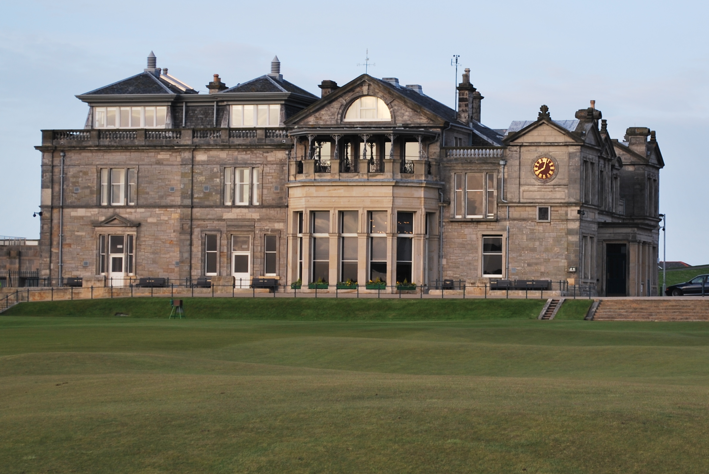 Royal and Ancient Golf Clubhouse at St Andrews, with its curved stone façade overlooking the Old Course