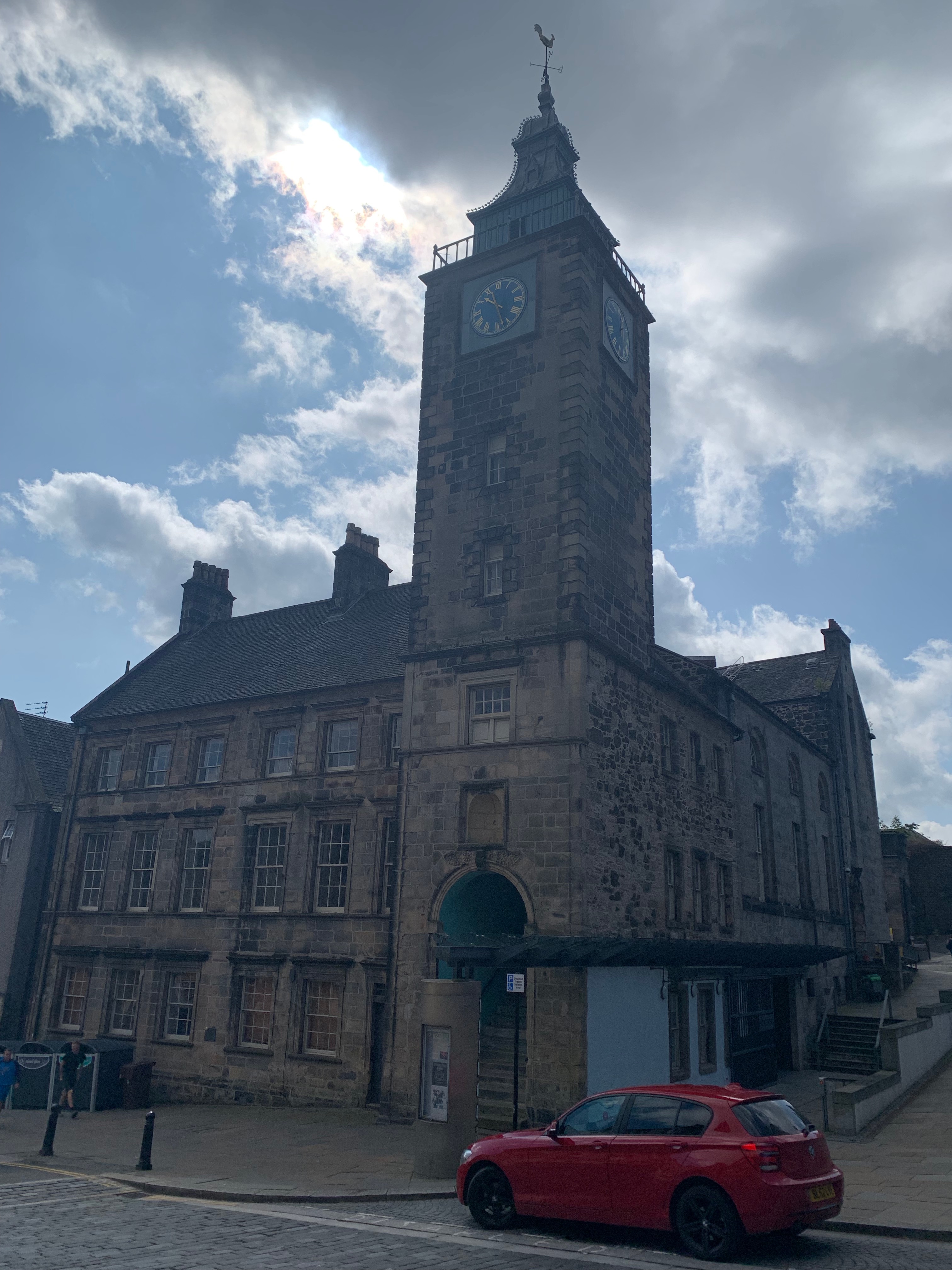 Stirling Tolbooth’s stone frontage and clock tower on Jail Wynd.