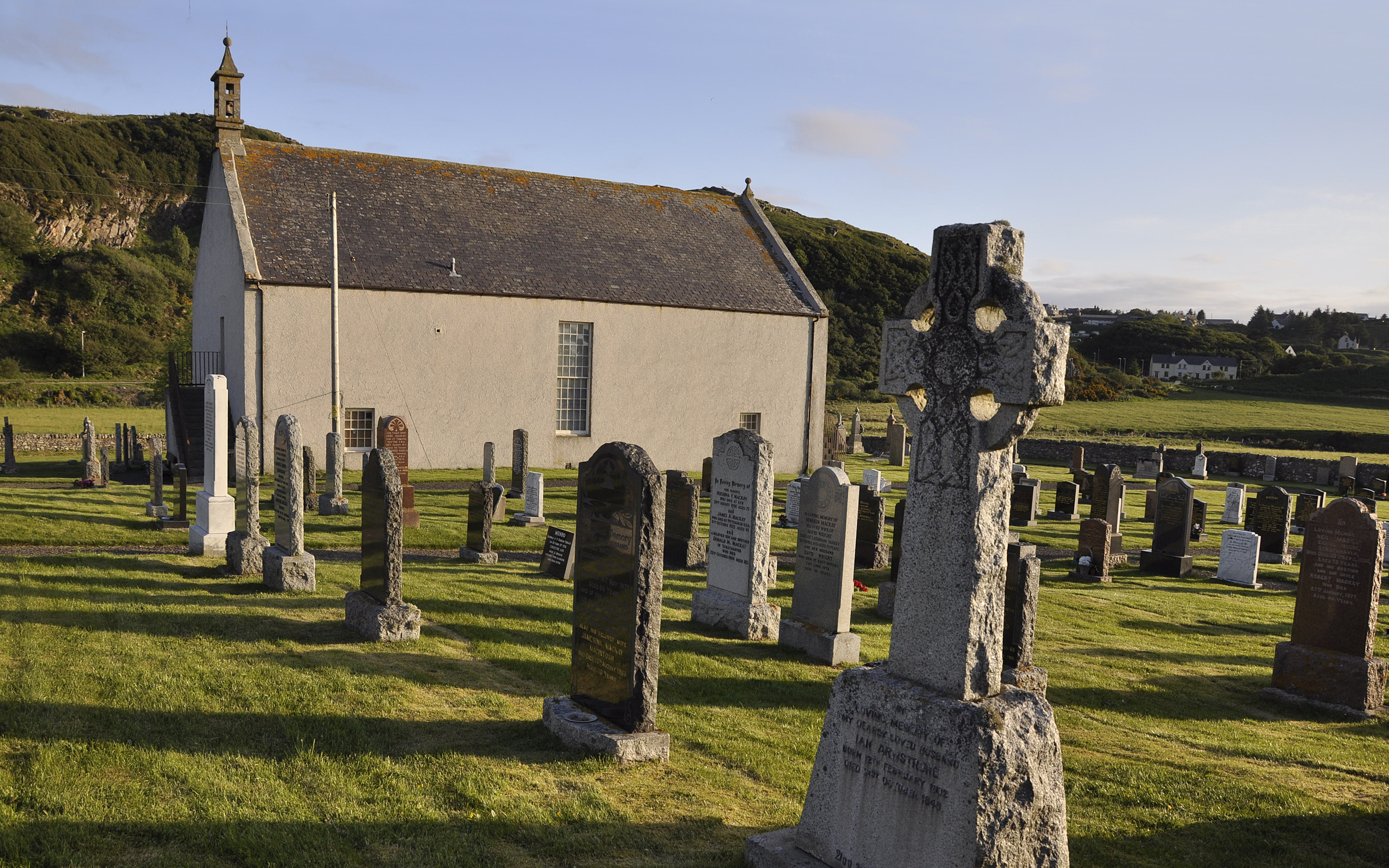 Farr Old Church at Bettyhill, now Strathnaver Museum, a white harled church with a small bellcote