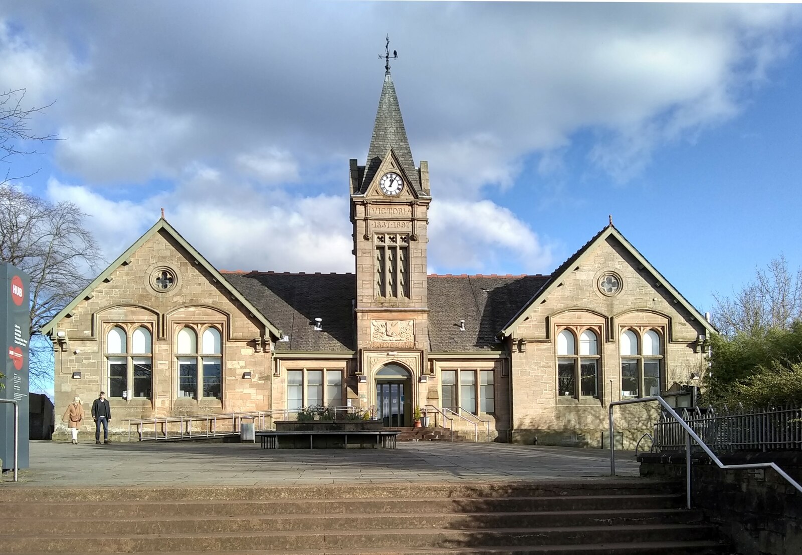 Bishopbriggs Library’s symmetrical Gothic stone frontage and central clock tower.