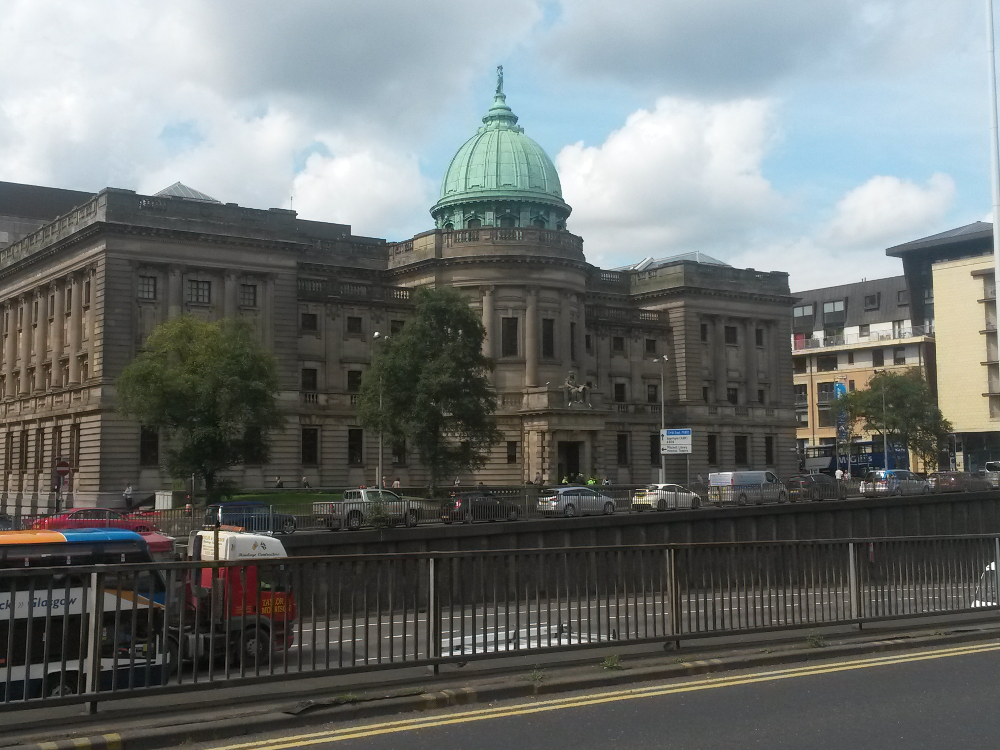 The Mitchell Library in Glasgow, showing its monumental stone exterior and copper dome.