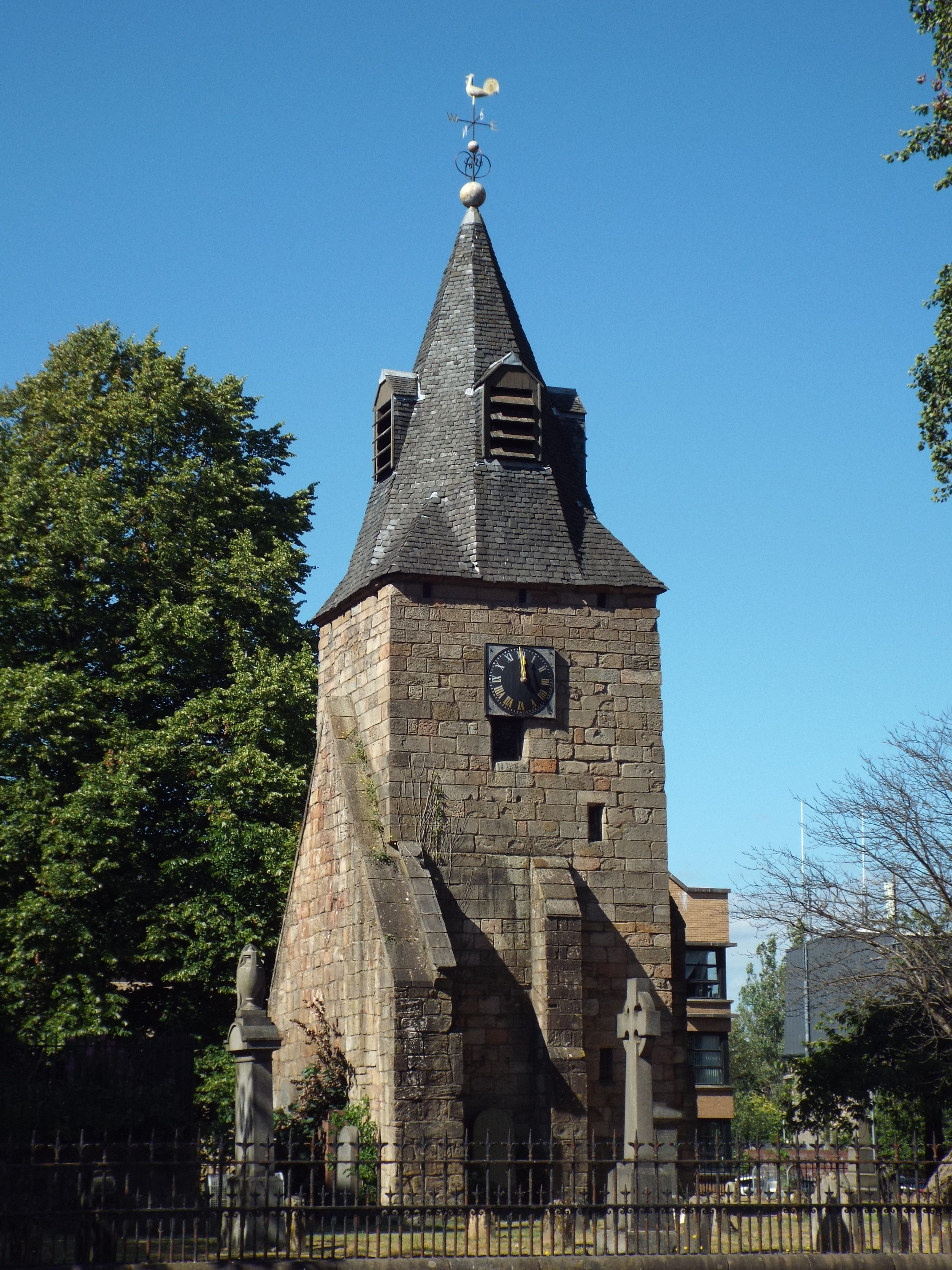 The freestanding medieval tower and fragments of the old church in Rutherglen churchyard