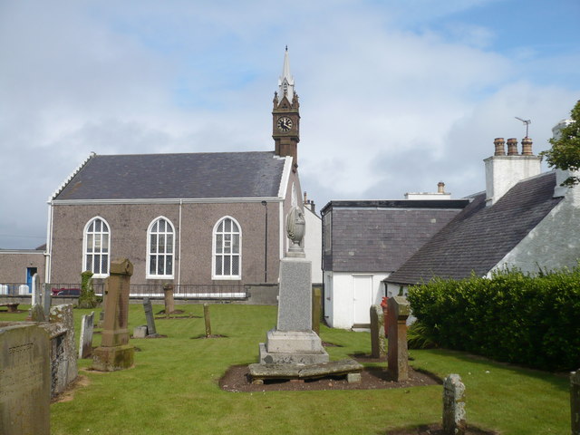Ballantrae Parish Church viewed across the churchyard, showing its harled walls and tower