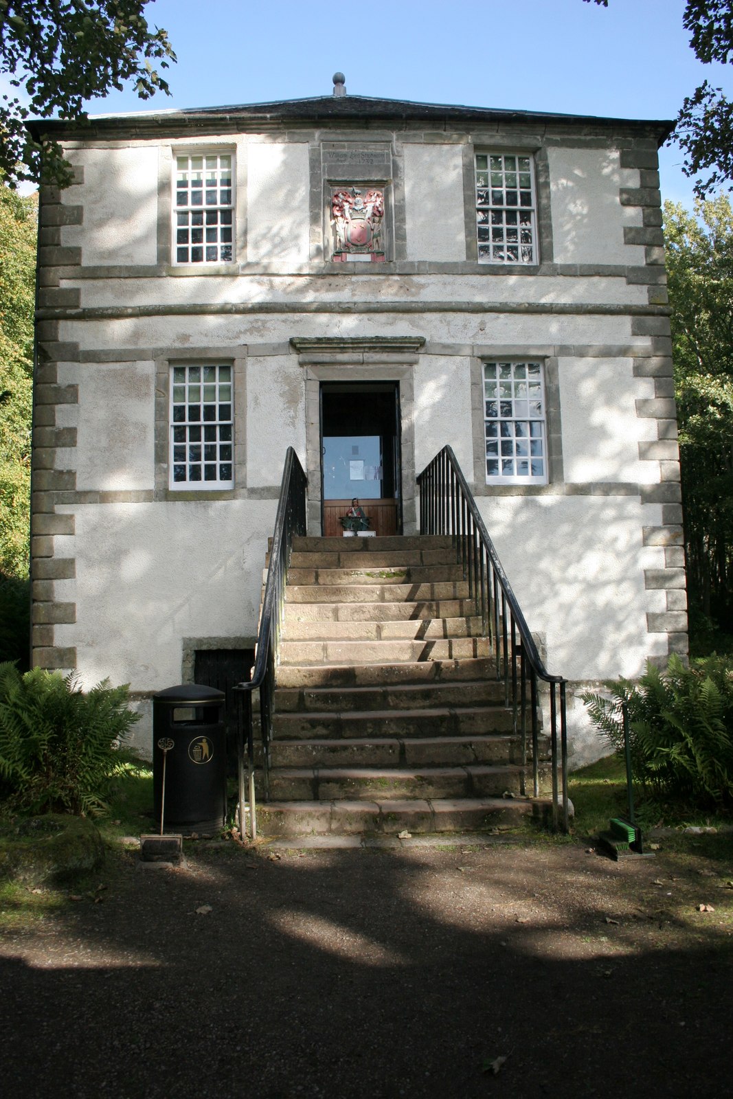 The two-storey garden pavilion at Dunrobin Castle, with its symmetrical stone front, central stair and pyramidal roof.