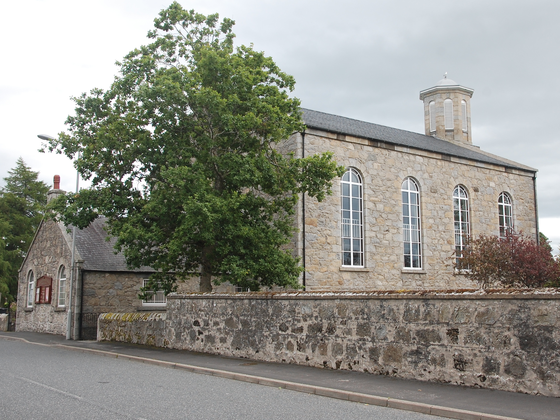 Granite walls and octagonal tower of New Marnoch Church in Aberchirder