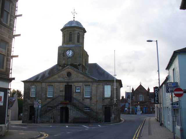 Sanquhar Tolbooth's symmetrical stone frontage and central clock tower, now housing the town museum.