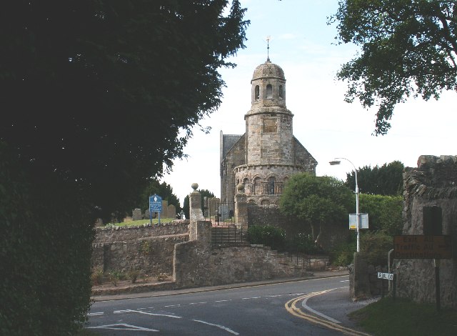 St Athernase Church at Leuchars, with its Romanesque apse, tower and stone nave seen from the churchyard.