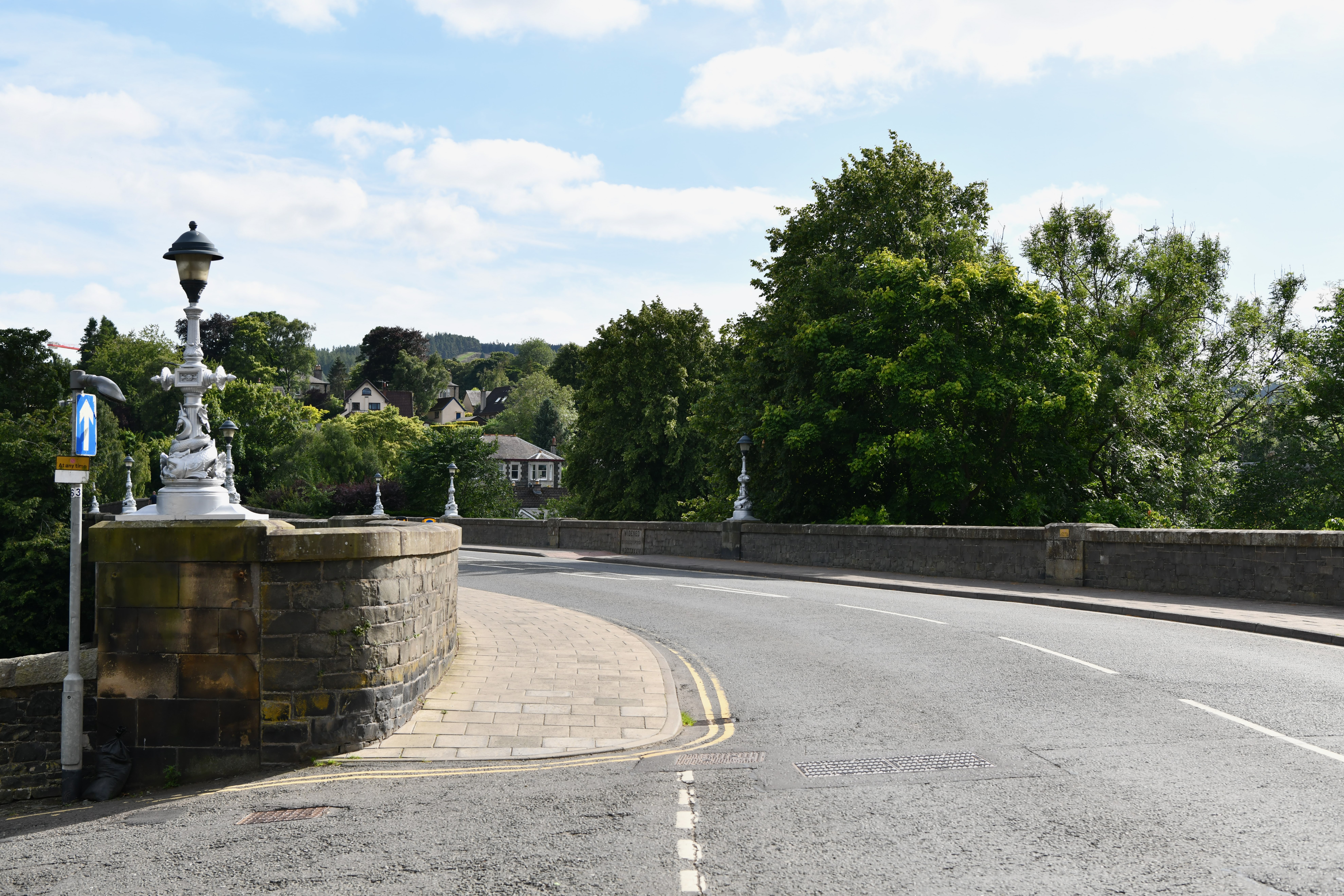 The historic stone Tweed Bridge crossing the River Tweed at Peebles.